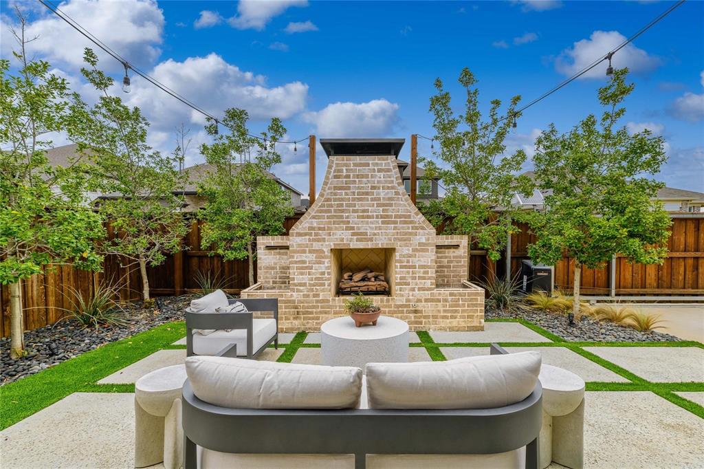 2262 Poppyvine Road Frisco, TX 75033 - Photo 37 of 40 a view of a patio with couches table and chairs and potted plants