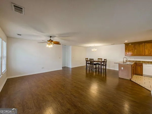 a view of a kitchen and dining room
