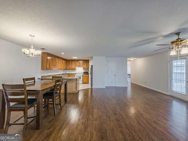 a view of a dining room with furniture and window