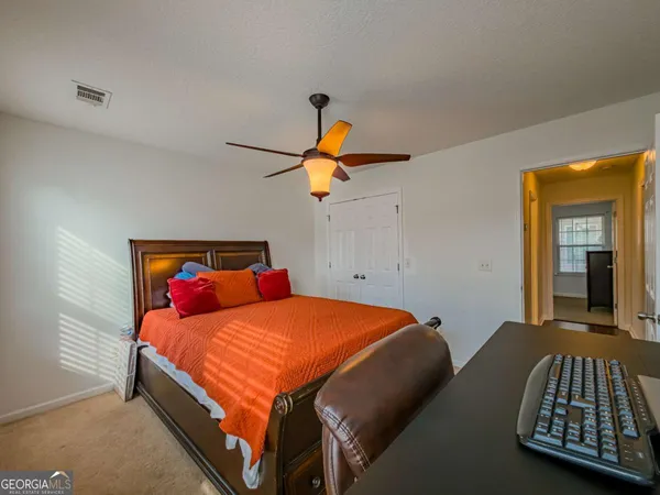 a bedroom with a bed and window