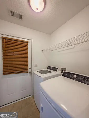 a utility room with washer and dryer