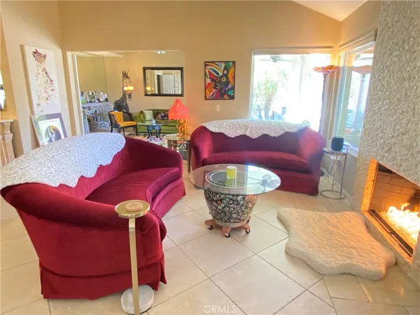 a view of living room and workspace