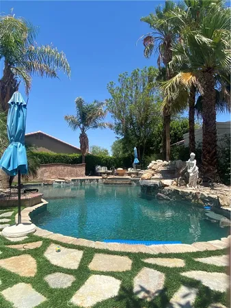 a view of swimming pool from a lake view