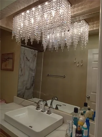 a bathroom with a sink and mirror