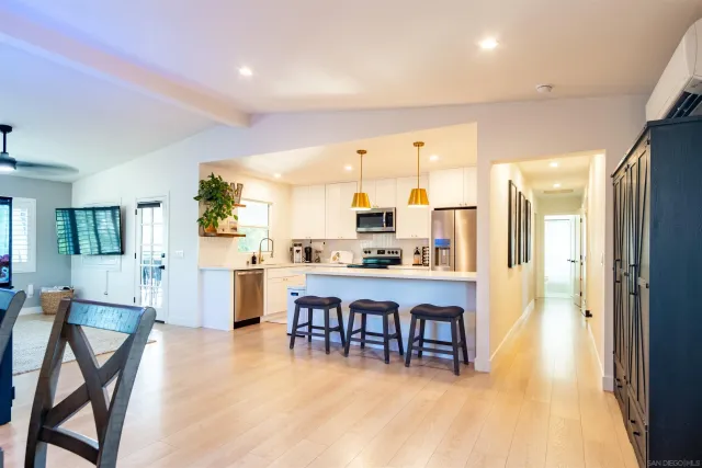 a kitchen with a table and chairs