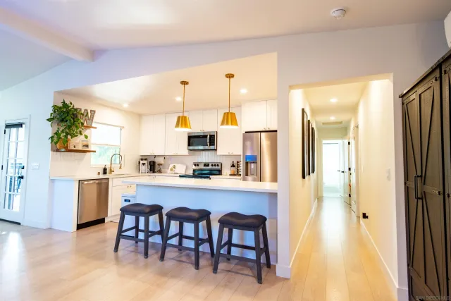a view of a dining room with furniture and window