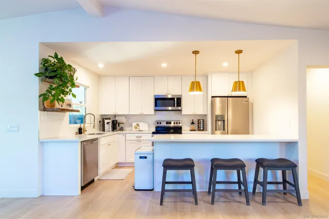 a view of a dining room with furniture and a wooden floor