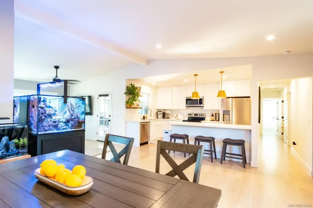 a view of a dining room with furniture and window