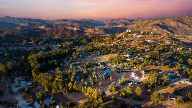 a kitchen with a sink a stove a refrigerator and cabinets