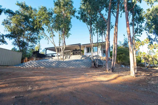 a view of a livingroom with furniture and a chandelier