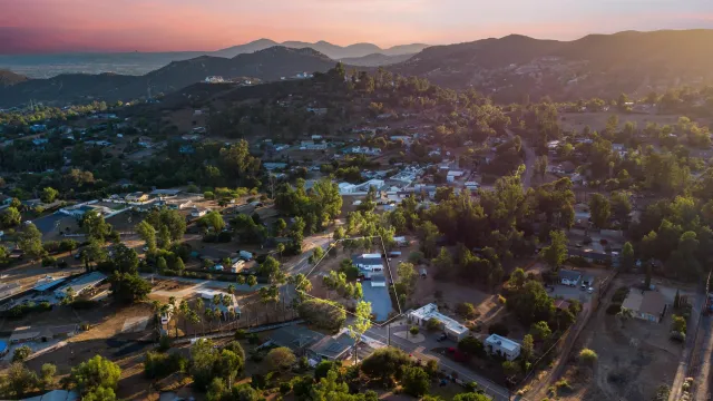 a large kitchen with stainless steel appliances kitchen island a large counter space a sink and a window