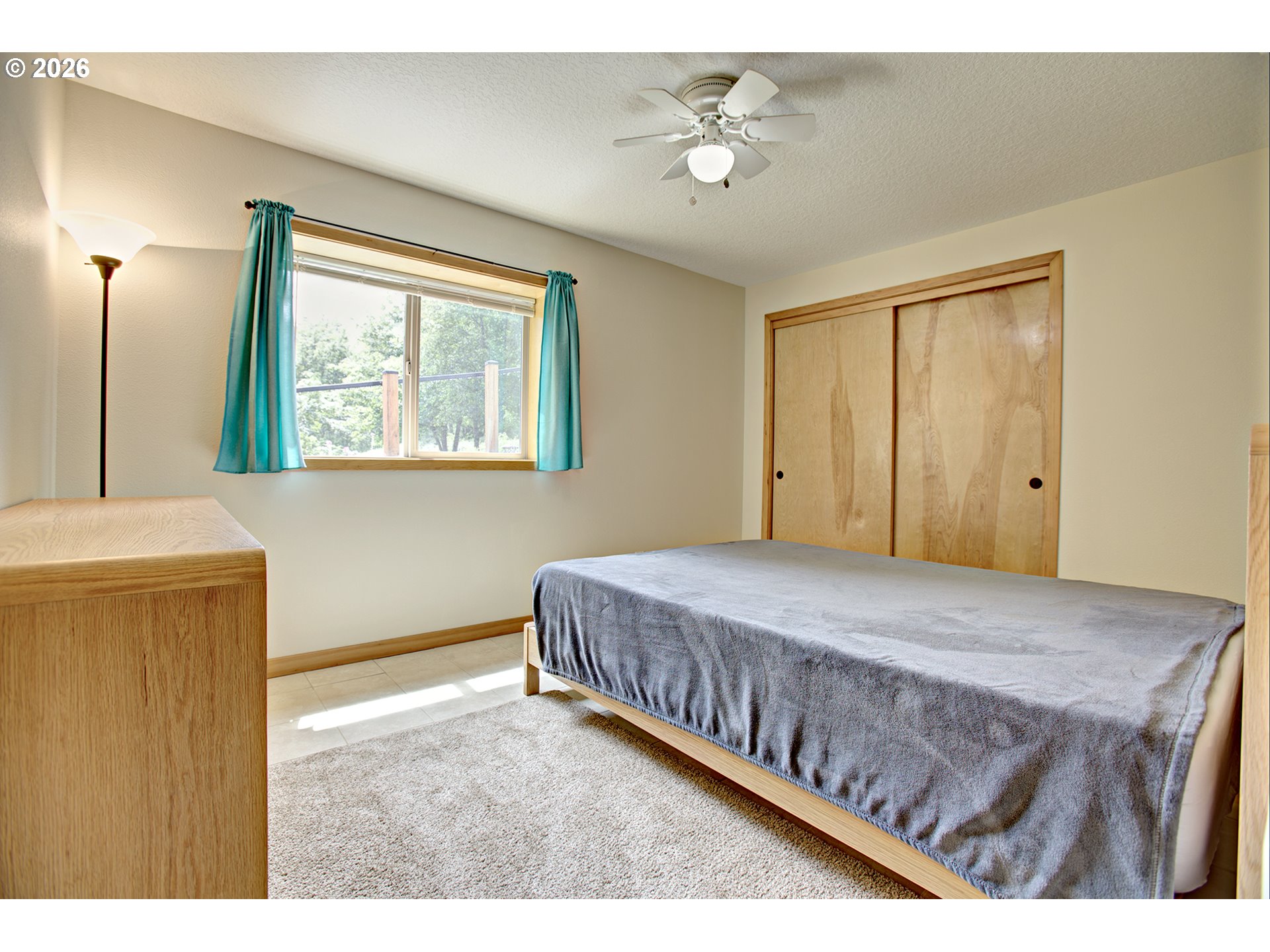 60300 Rays Way St. Helens, OR 97051 - Photo 32 of 41 a bedroom with a bed and a chandelier