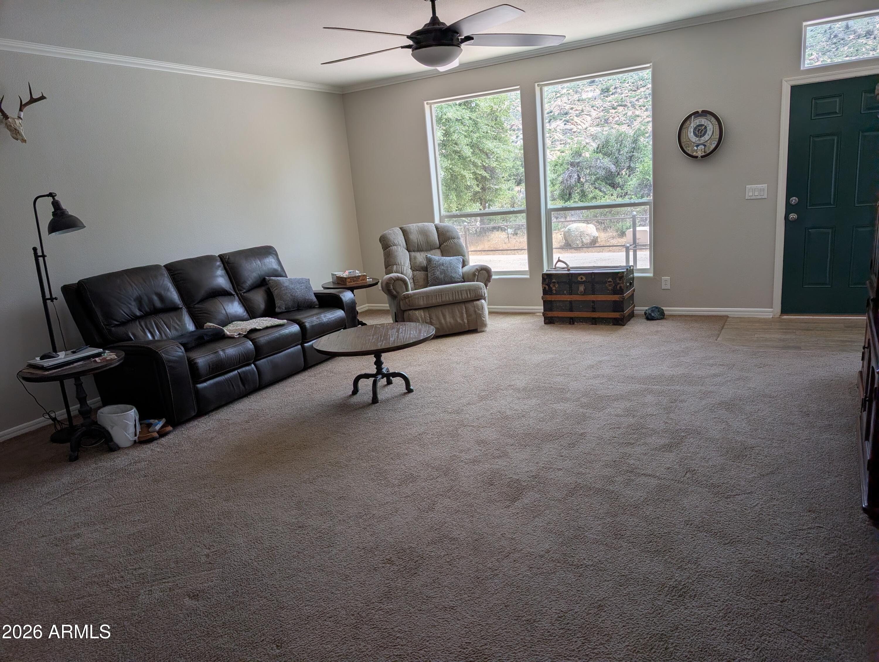 51092 North Pinal Ranch Road Miami, AZ 85539 - Photo 11 of 13 a living room with furniture and a large window