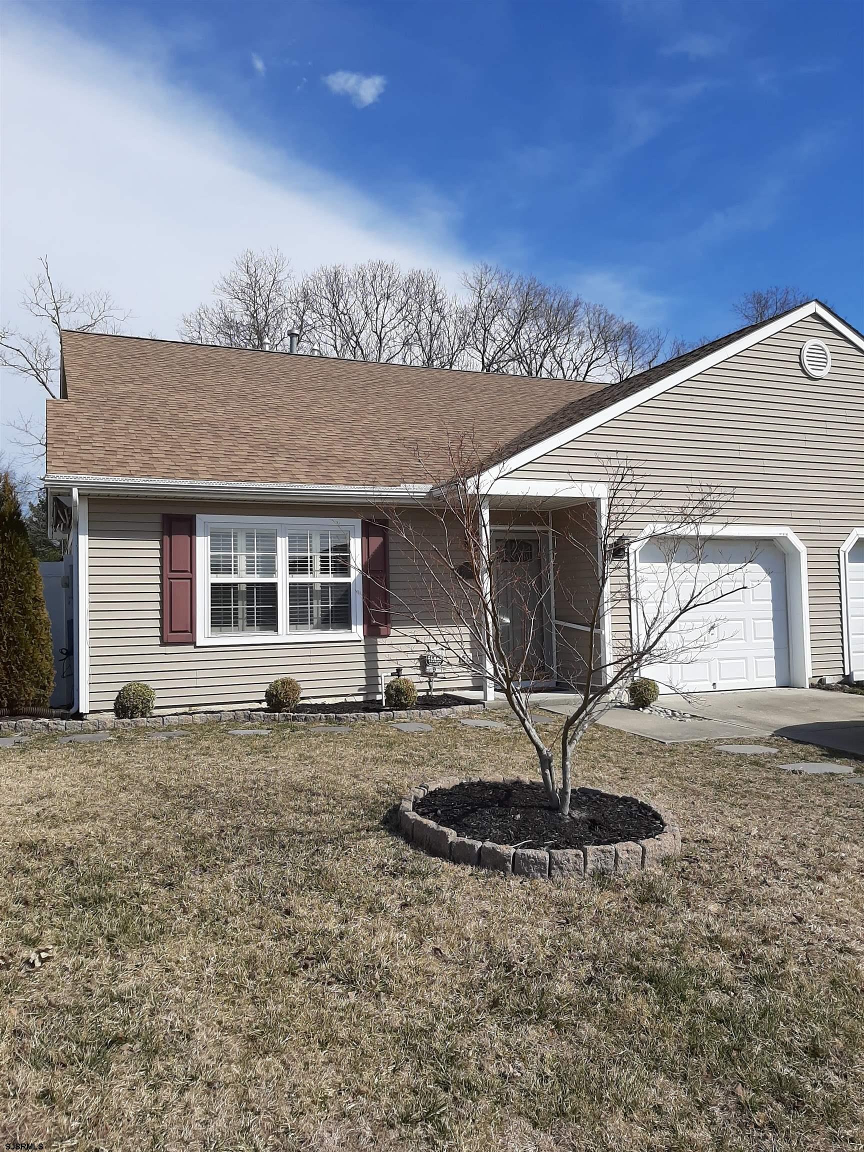 9 Pacific Avenue, Unit 9 Somers Point, NJ 08244 - Photo 1 of 19 a front view of a house with garden