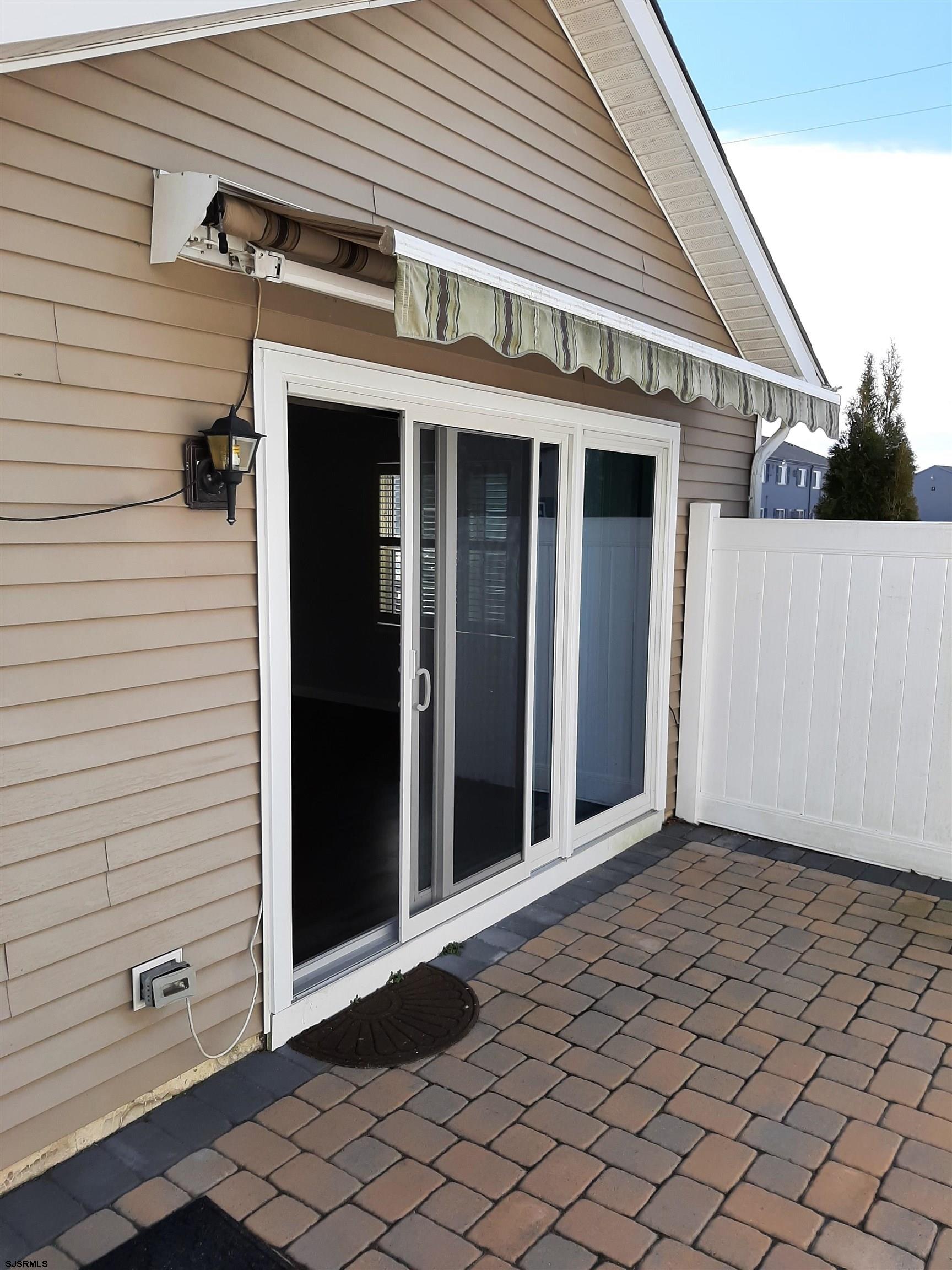 9 Pacific Avenue, Unit 9 Somers Point, NJ 08244 - Photo 16 of 19 a view of a house with backyard