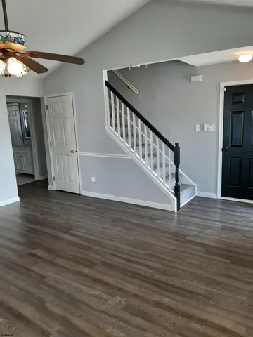 a view of an entryway with wooden floor