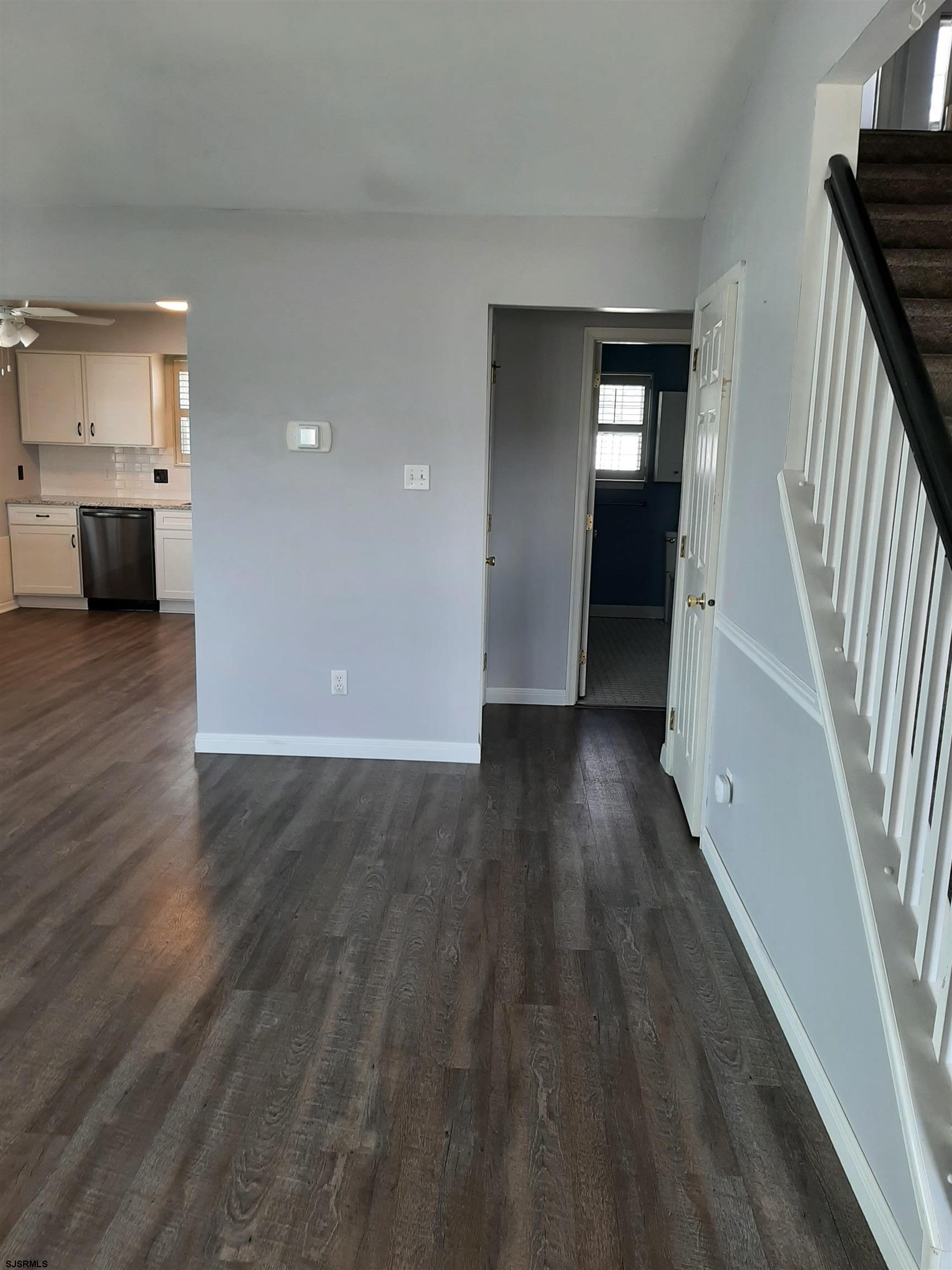 9 Pacific Avenue, Unit 9 Somers Point, NJ 08244 - Photo 4 of 19 a view of entryway with wooden floor and stairs