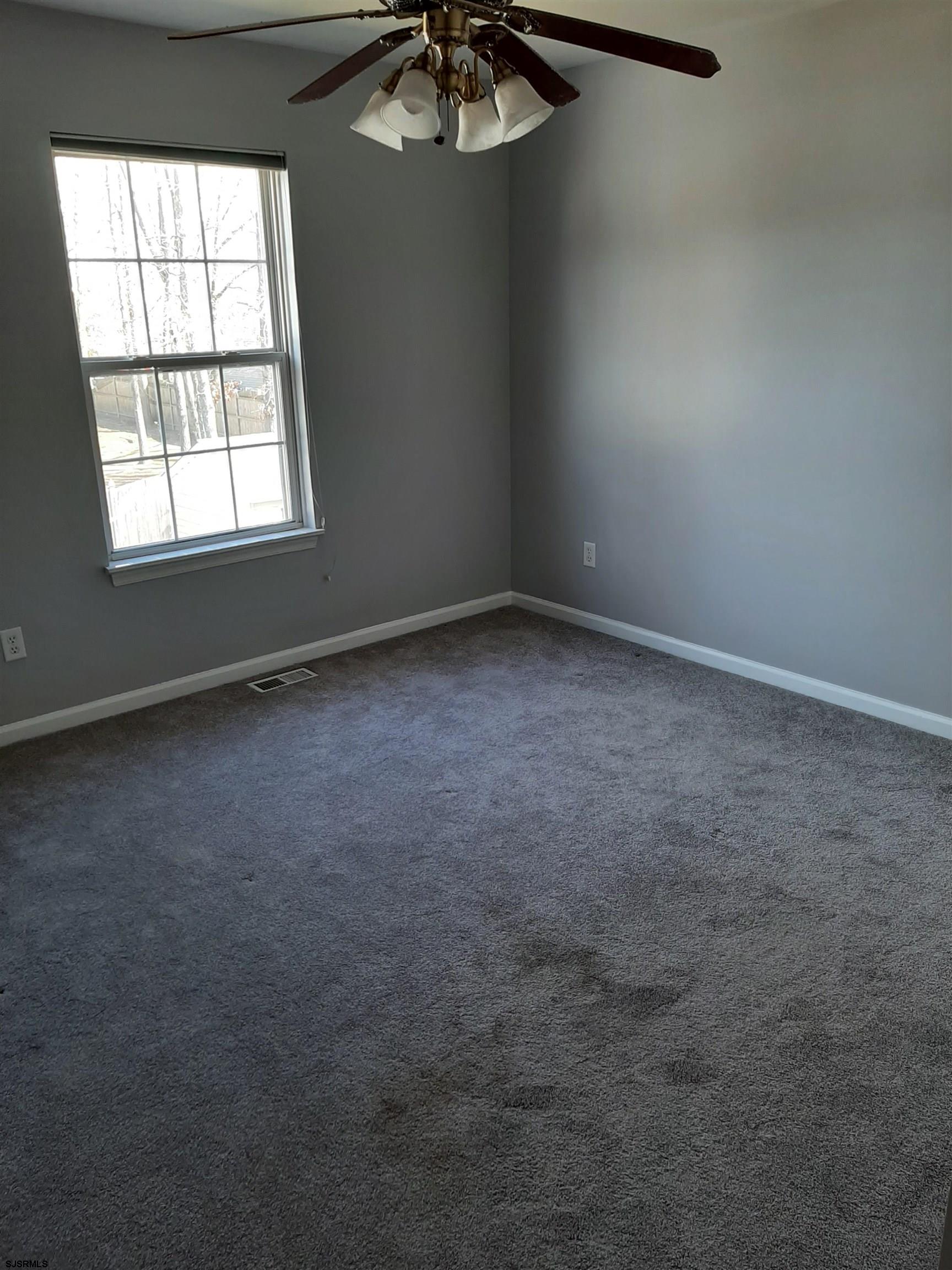 9 Pacific Avenue, Unit 9 Somers Point, NJ 08244 - Photo 10 of 19 an empty room with a window