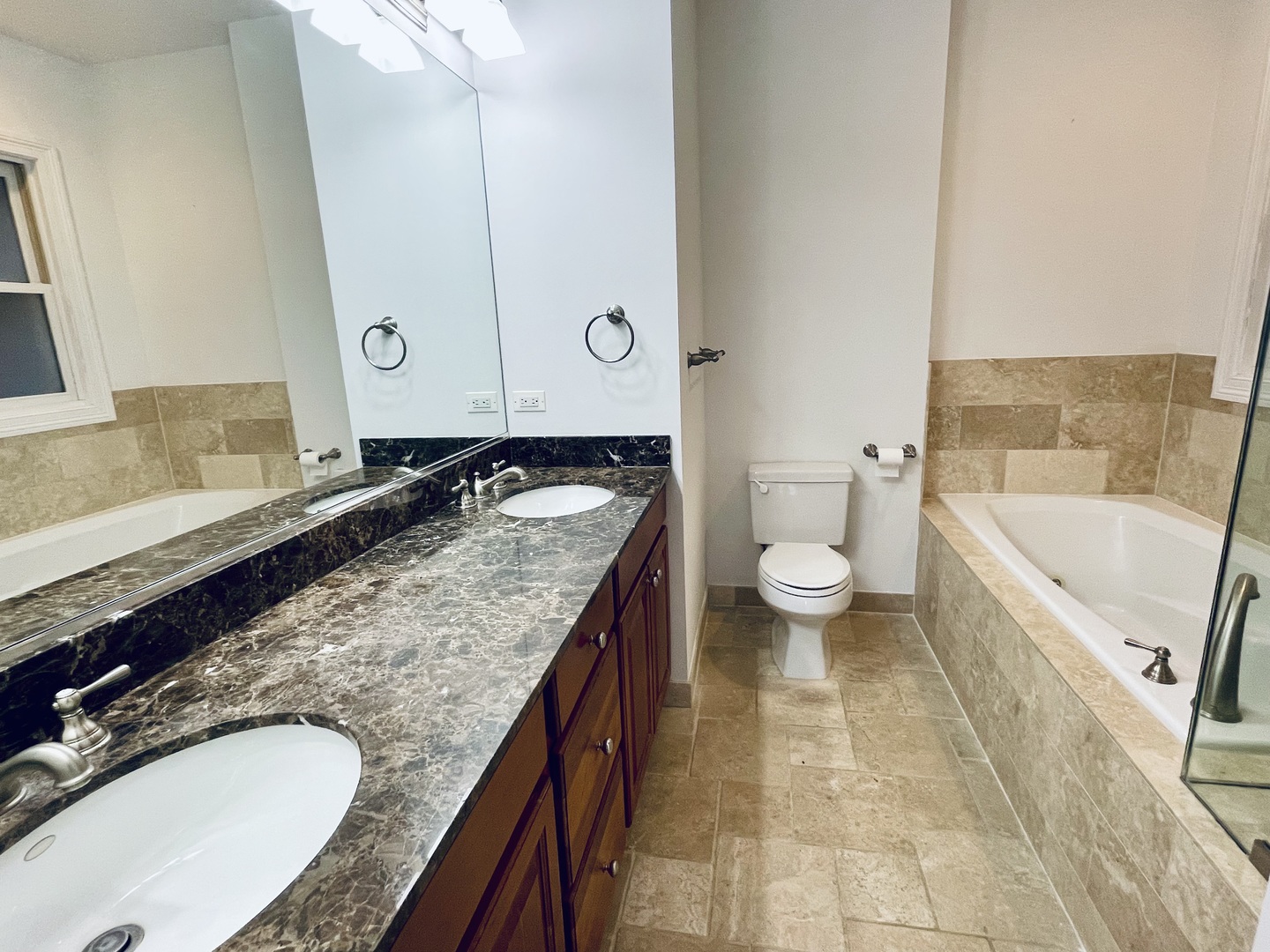 1053 West Cornelia Avenue, Unit 2 Chicago, IL 60657 - Photo 10 of 14 a bathroom with a granite countertop sink and a mirror