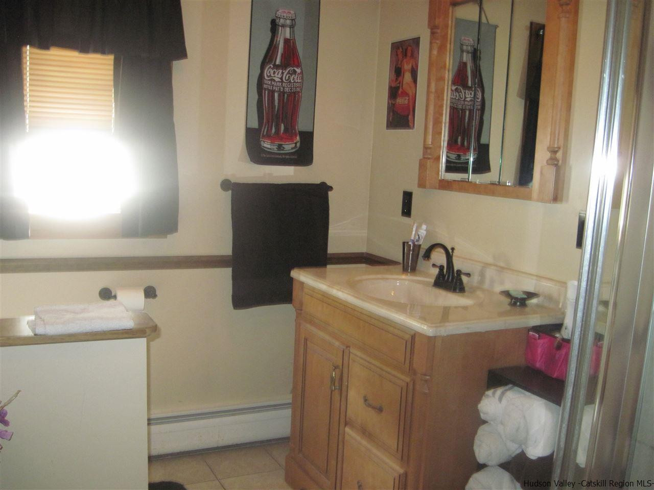 3 Hewlett Road Red Hook, NY 12571 - Photo 3 of 22 a bathroom with a sink and a mirror