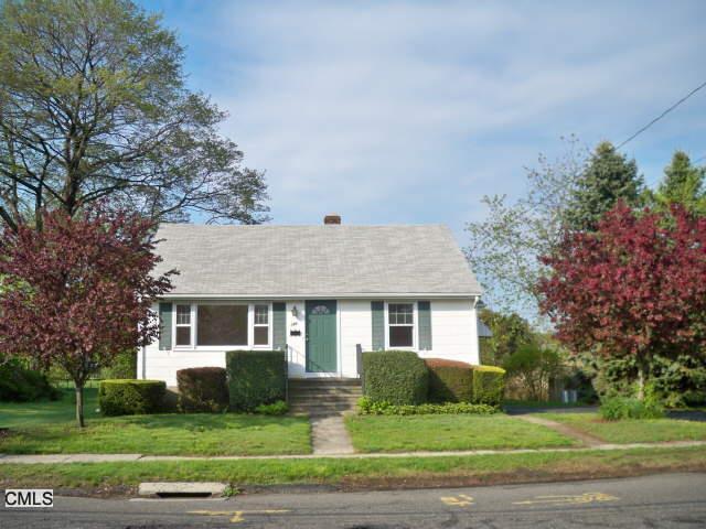 196 Riverside Drive Fairfield, CT 06824 - Photo 1 of 1 a front view of a house with a yard
