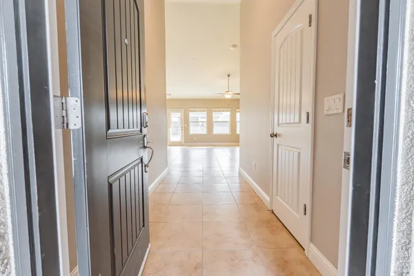 a view of a hallway with windows