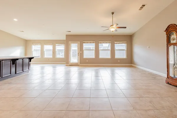 a view of an empty room with windows