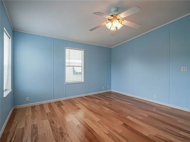 a view of room with window and ceiling fan