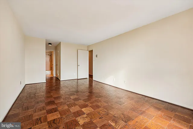 a living room with furniture a rug and a large window
