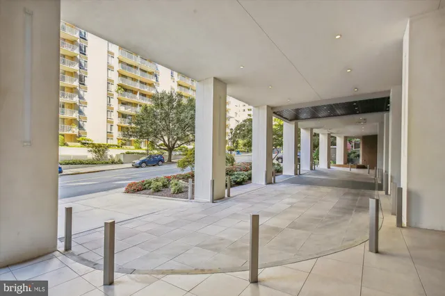 a view of a swimming pool with an outdoor seating