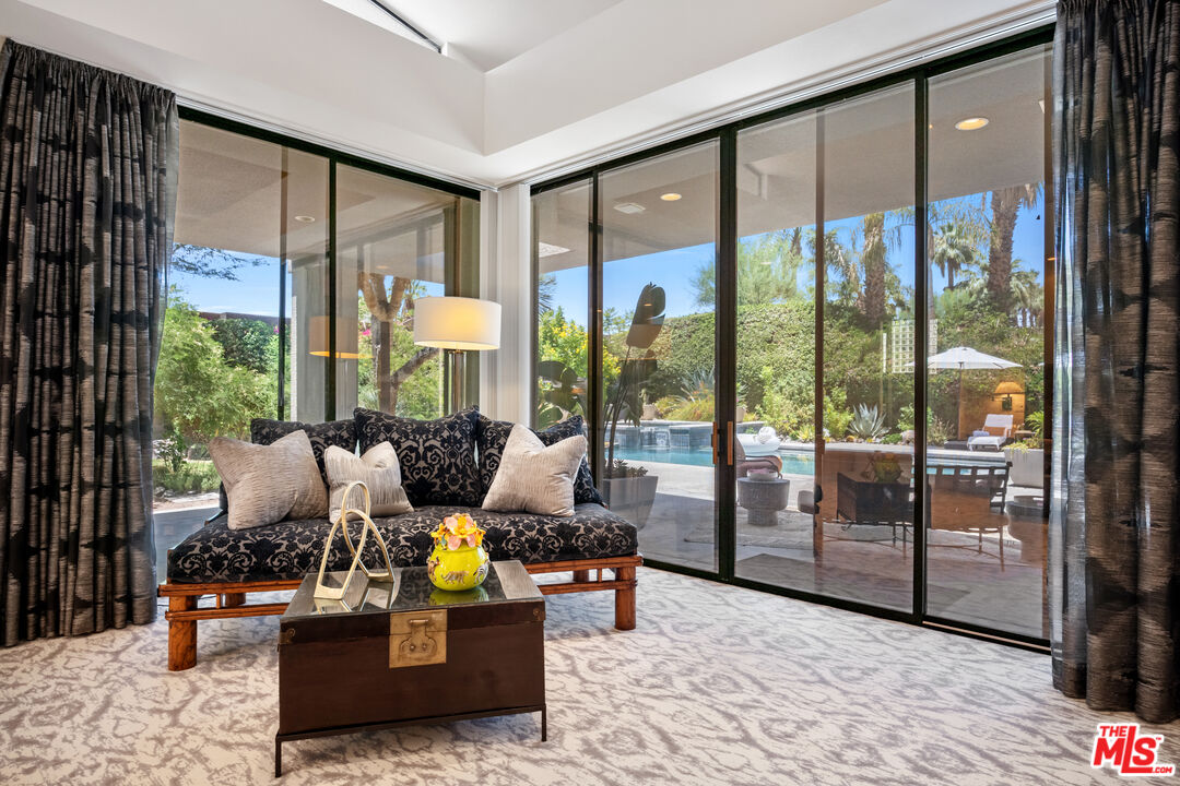 6 Rocky Lane Rancho Mirage, CA 92270 - Photo 34 of 57 a living room filled with furniture and a large window