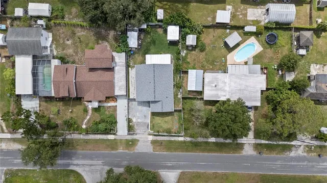 an aerial view of residential houses with city view