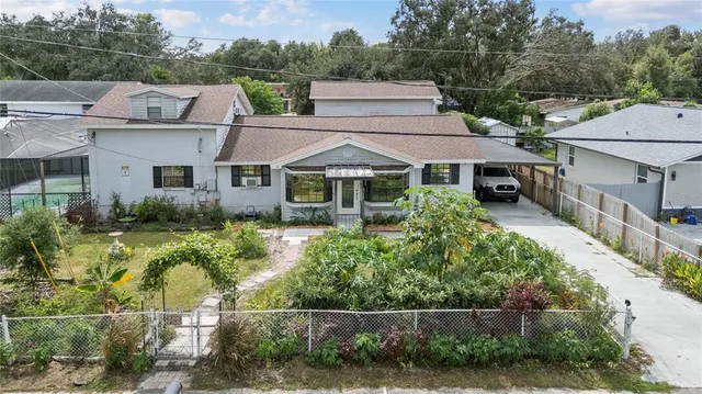 an aerial view of houses with swimming pool