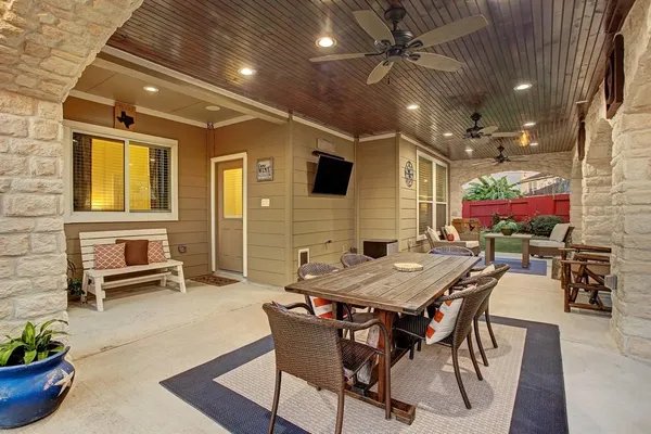 a view of a patio with table and chairs
