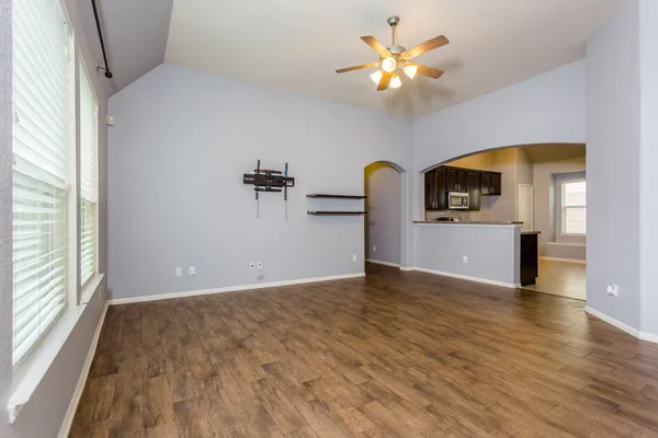 a view of a kitchen with a dishwasher cabinets and wooden floor