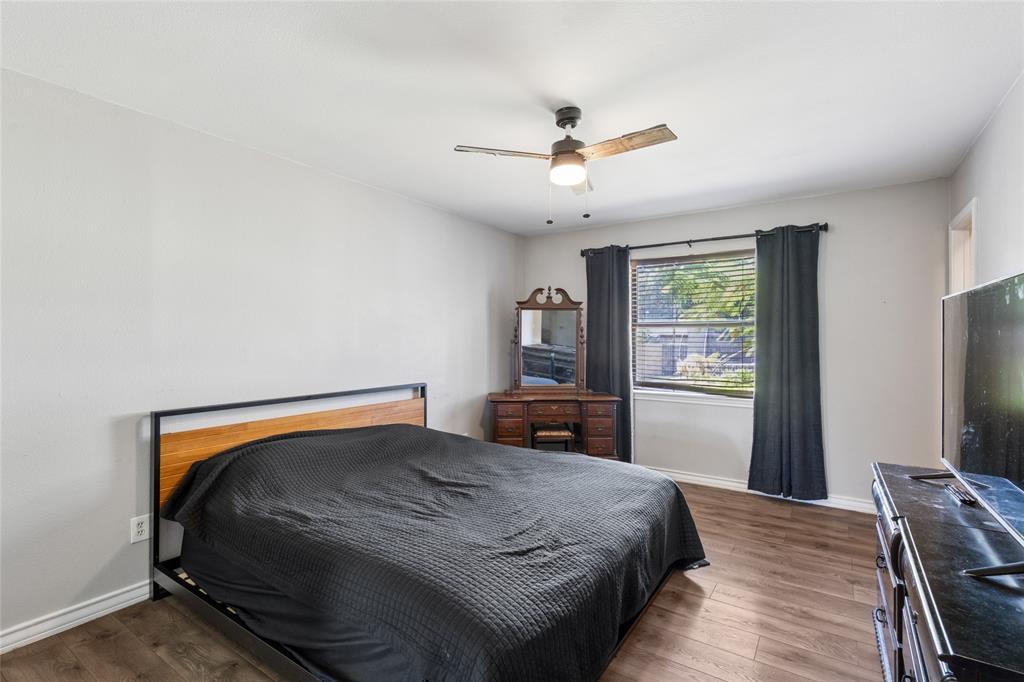 248 Mountain View Drive Azle, TX 76020 - Photo 13 of 26 a bedroom with a bed and a flat screen tv