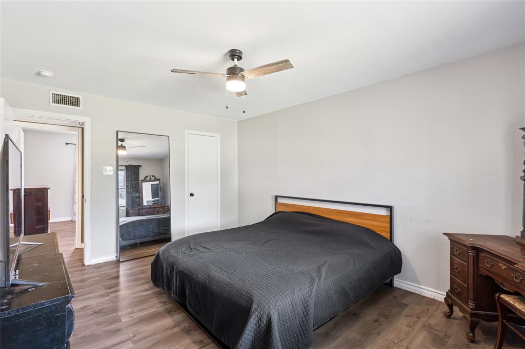 248 Mountain View Drive Azle, TX 76020 - Photo 14 of 26 a bedroom with a bed and wooden floor