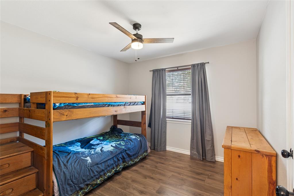 248 Mountain View Drive Azle, TX 76020 - Photo 16 of 26 a bedroom with a bed and a window