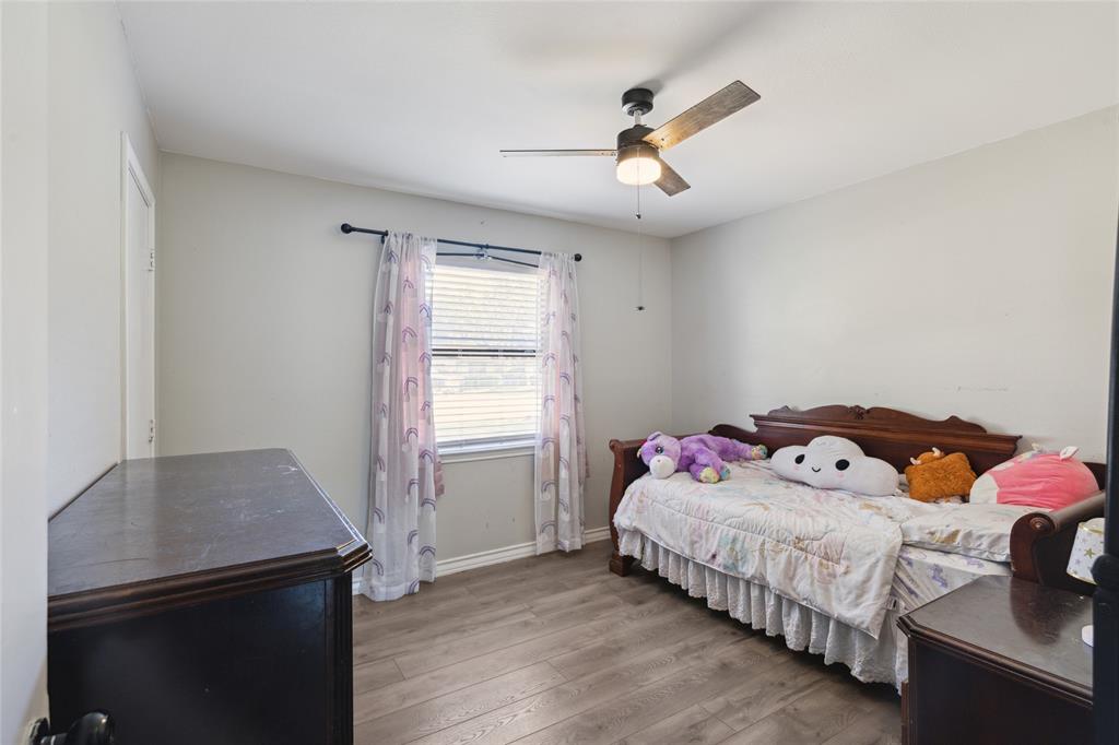 248 Mountain View Drive Azle, TX 76020 - Photo 17 of 26 a bedroom with a bed and a window