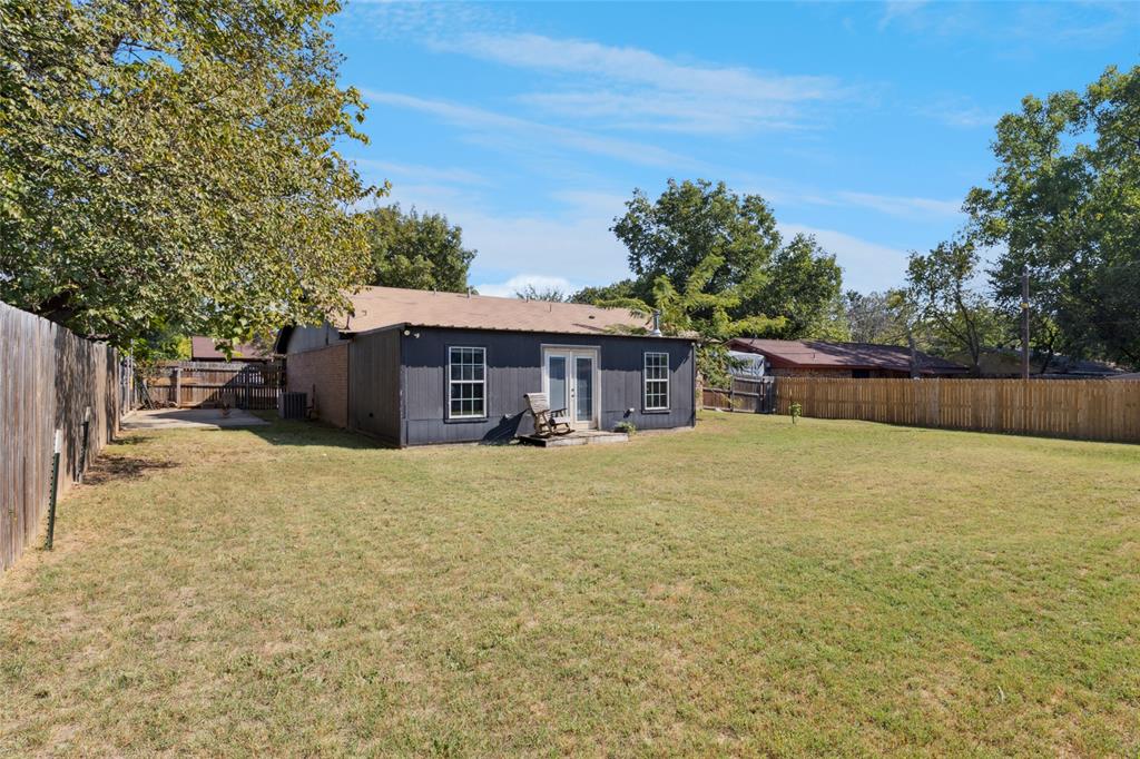 248 Mountain View Drive Azle, TX 76020 - Photo 22 of 26 a view of a house with a yard and a large tree