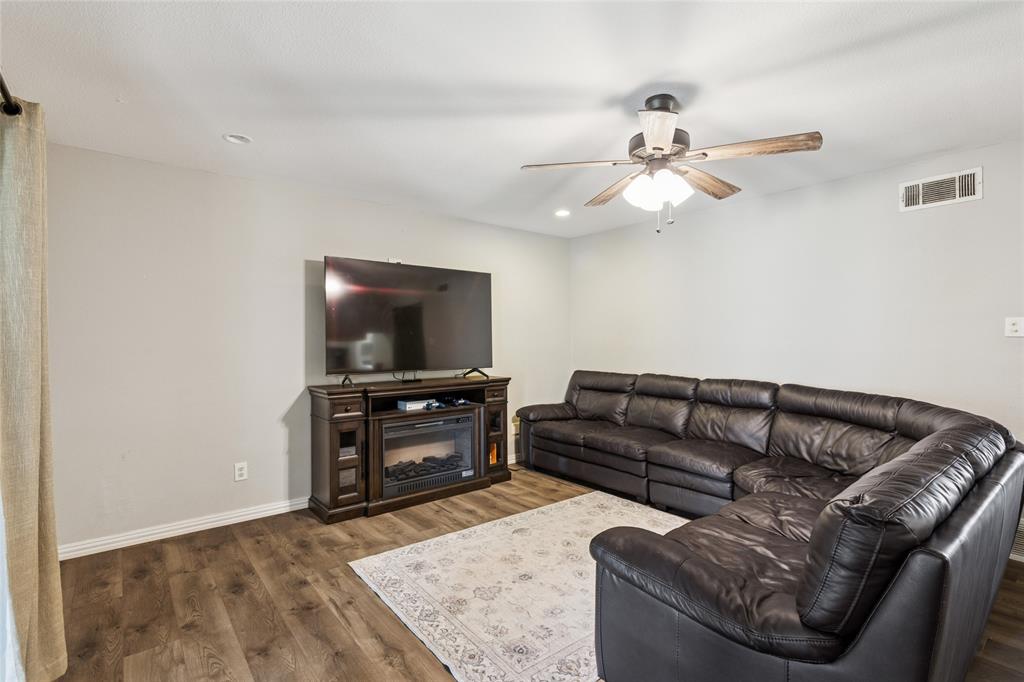 248 Mountain View Drive Azle, TX 76020 - Photo 6 of 26 a living room with furniture and a flat screen tv