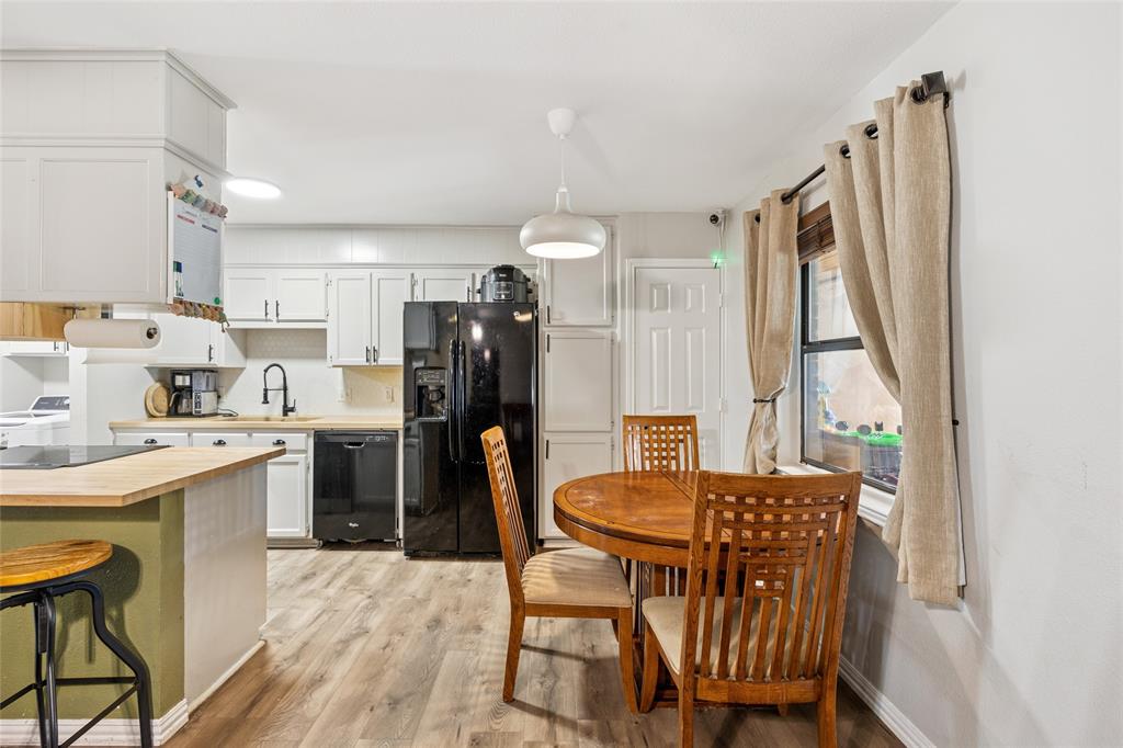 248 Mountain View Drive Azle, TX 76020 - Photo 8 of 26 a view of a dining room with furniture and a window
