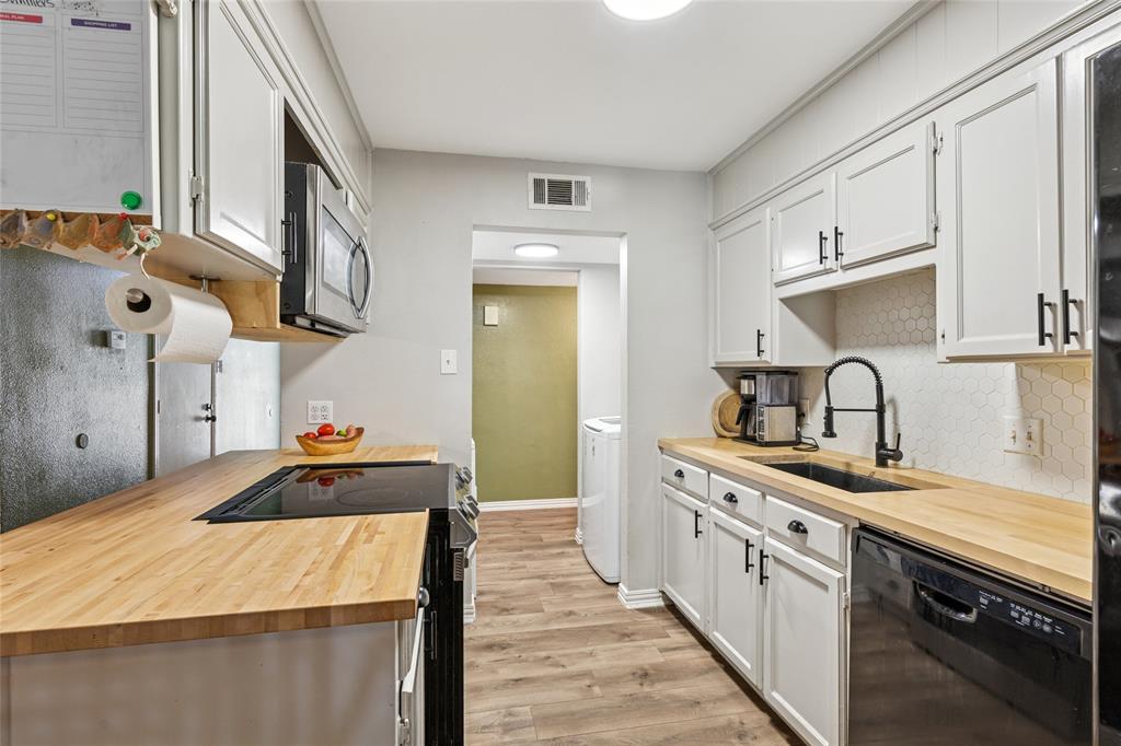 248 Mountain View Drive Azle, TX 76020 - Photo 9 of 26 a kitchen with kitchen island a sink stove and cabinets