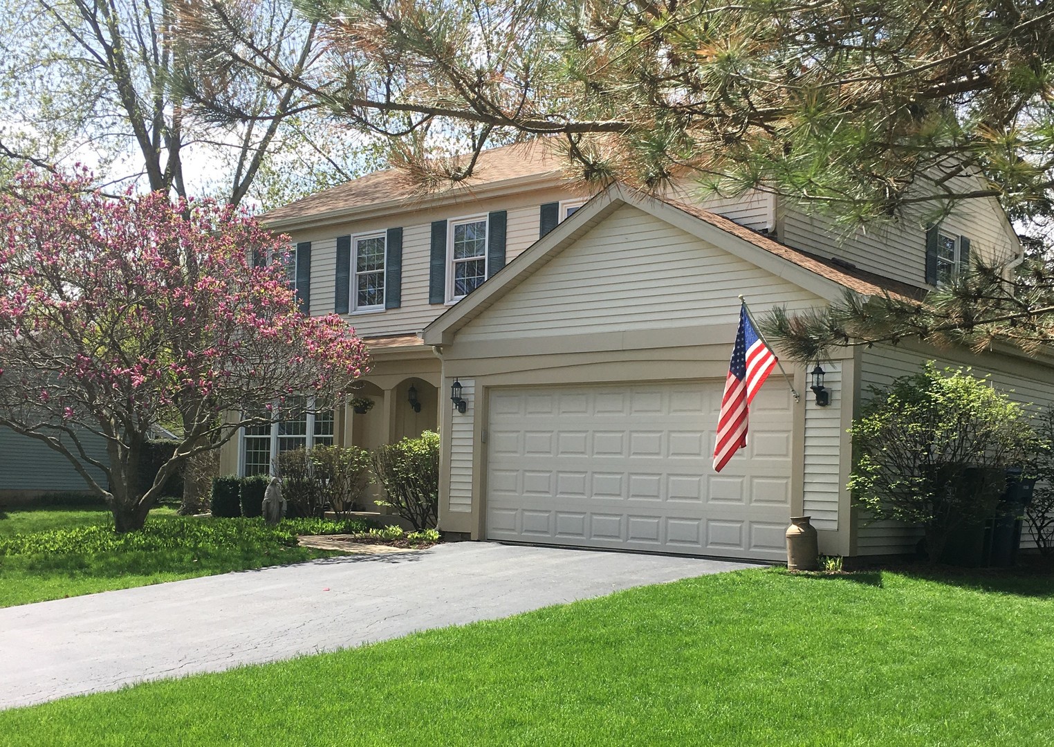 a view of a house with a yard and tree s