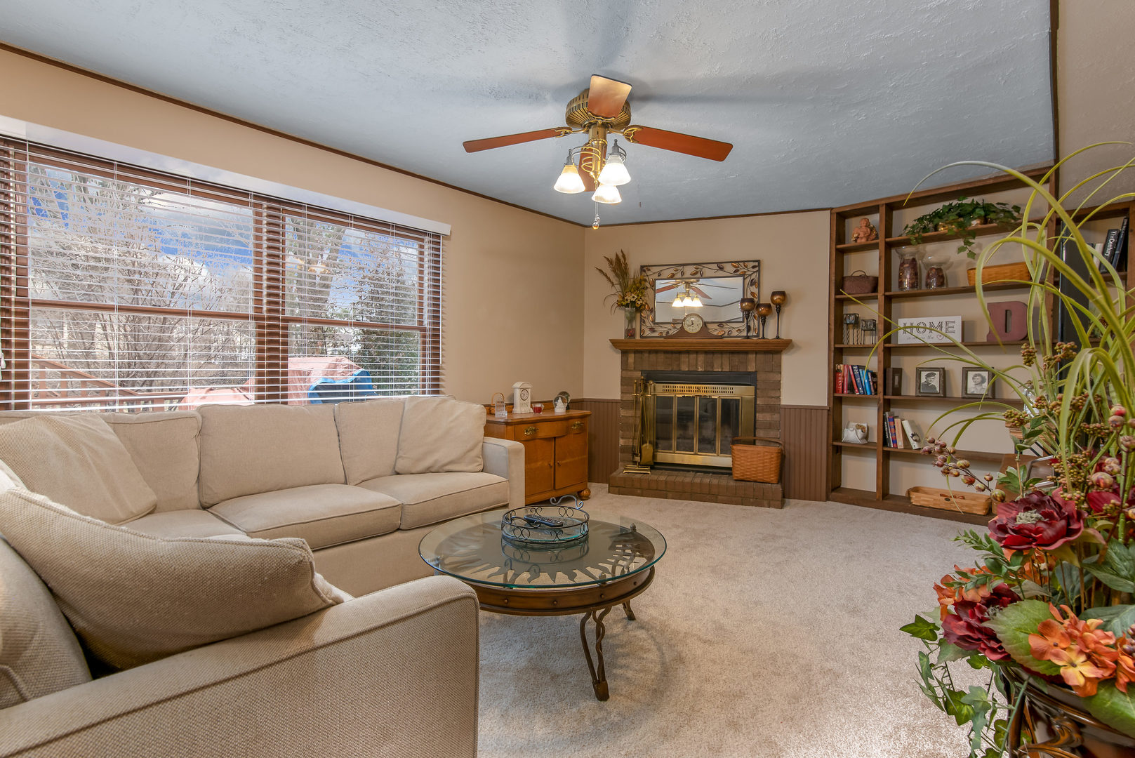 2105 Countryside Circle Naperville, IL 60565 - Photo 11 of 26 a living room with furniture a chandelier and a flat screen tv