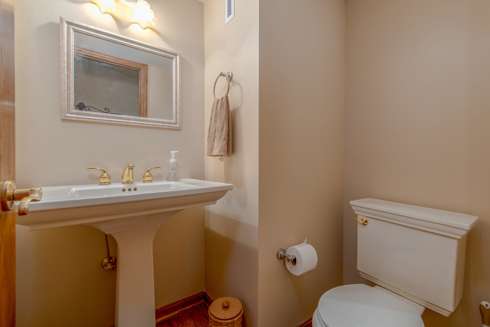 2105 Countryside Circle Naperville, IL 60565 - Photo 14 of 26 a bathroom with a toilet sink and mirror
