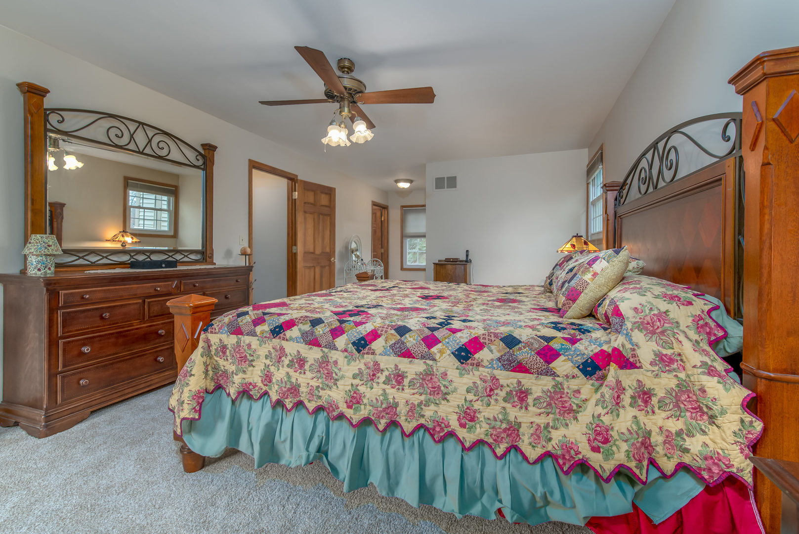 2105 Countryside Circle Naperville, IL 60565 - Photo 17 of 26 a bedroom with a bed and a chandelier