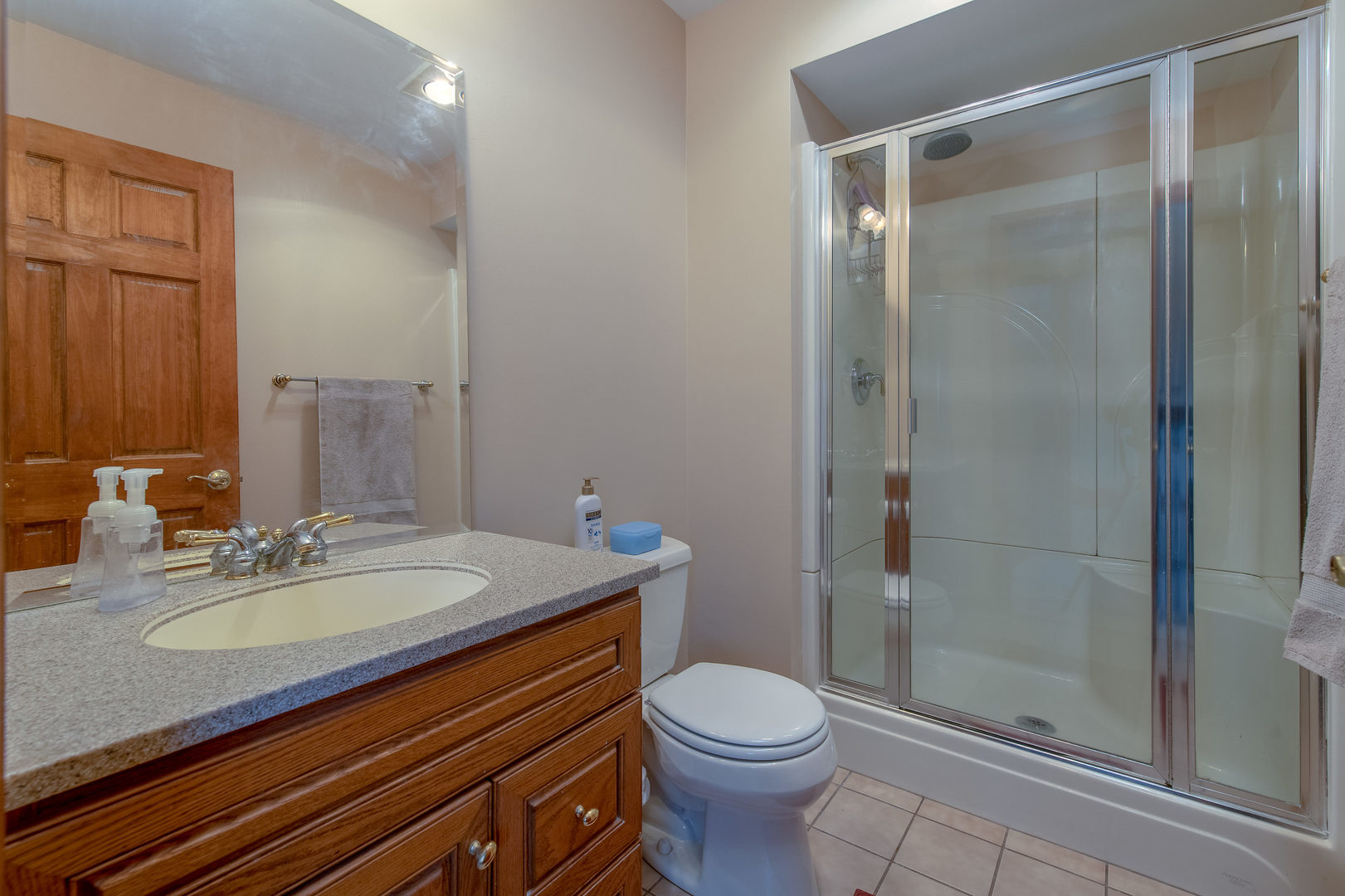 2105 Countryside Circle Naperville, IL 60565 - Photo 18 of 26 a bathroom with a sink a toilet and shower