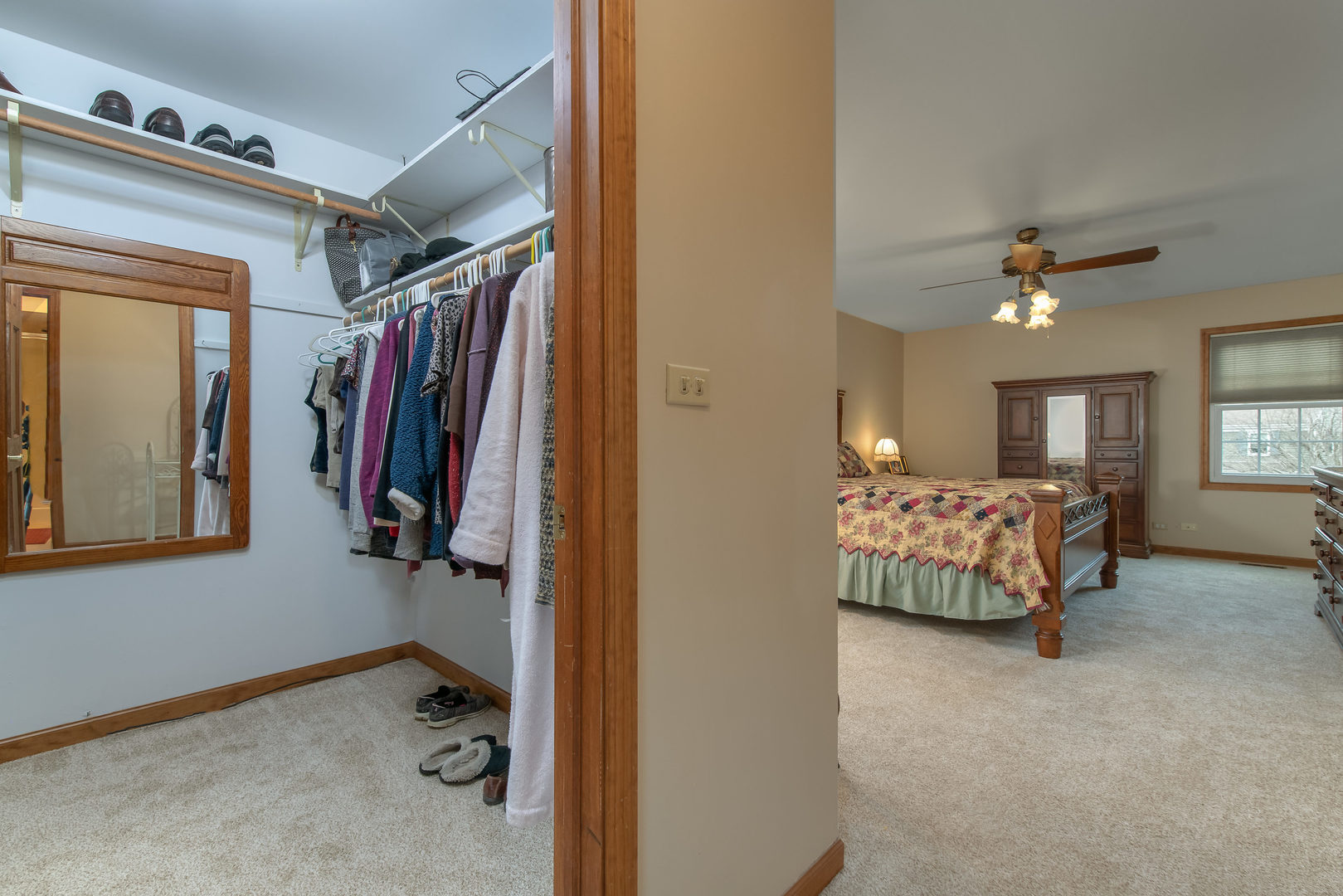 2105 Countryside Circle Naperville, IL 60565 - Photo 19 of 26 a view of walk in closet with clothes and shoes