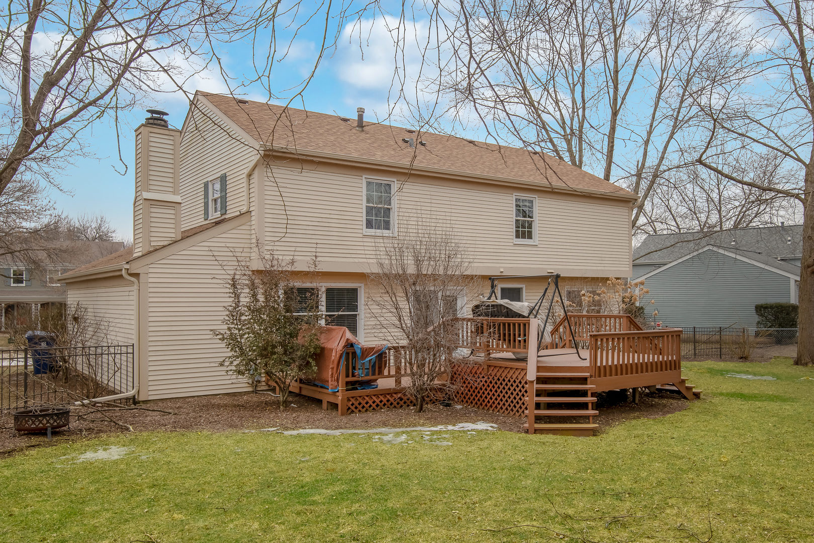 2105 Countryside Circle Naperville, IL 60565 - Photo 24 of 26 a backyard of a house with barbeque and wooden fence